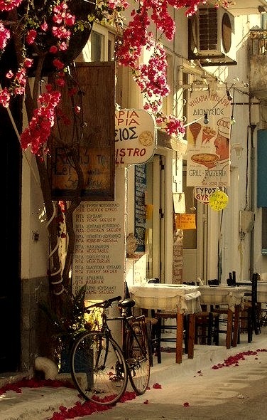 A lonely bike waits outside a taverna in Koroni, Greece