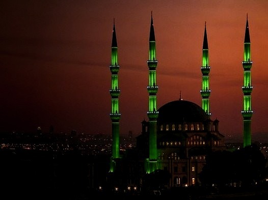 The minarets of Nizamiye Masjid glowing in the night, the largest mosque in southern hemisphere, Johannesburg, South Africa